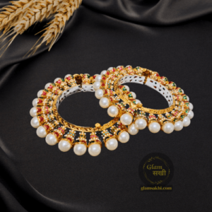 Pearl Meenakari Rajwadi Bangles by Glam Sakhi elegantly blends tradition & contemporary style. Reflect your unique charm with grace and rhythm.